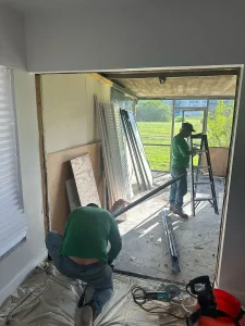 NF Home Improvements crew preparing wall opening for new sliding door installation