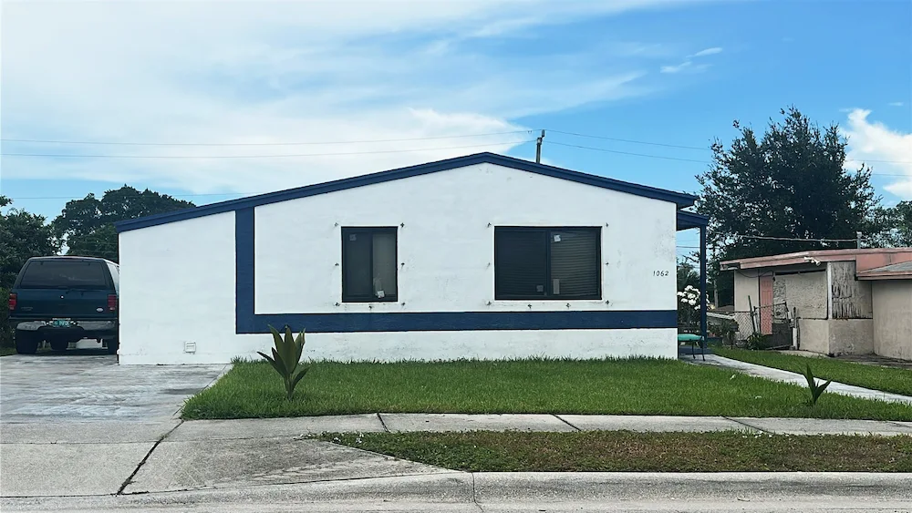 Front view of Palm Beach FL home after new window installations by NF Home Improvements
